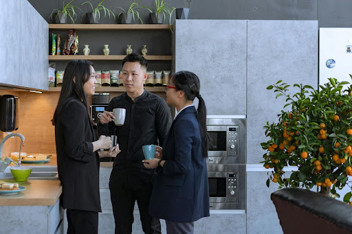 three people on coffee break at work