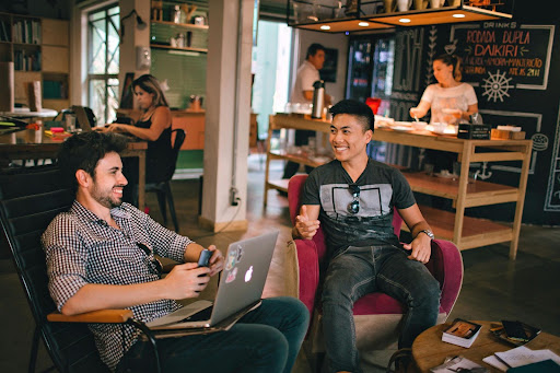 men talking in modern workspace