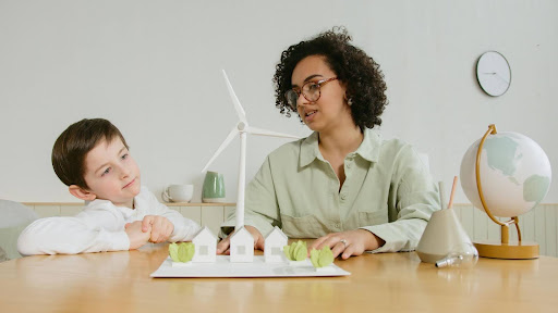 woman explaining renewable energy to kid